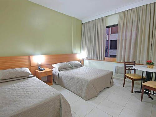 Cama do Malibu Palace Hotel